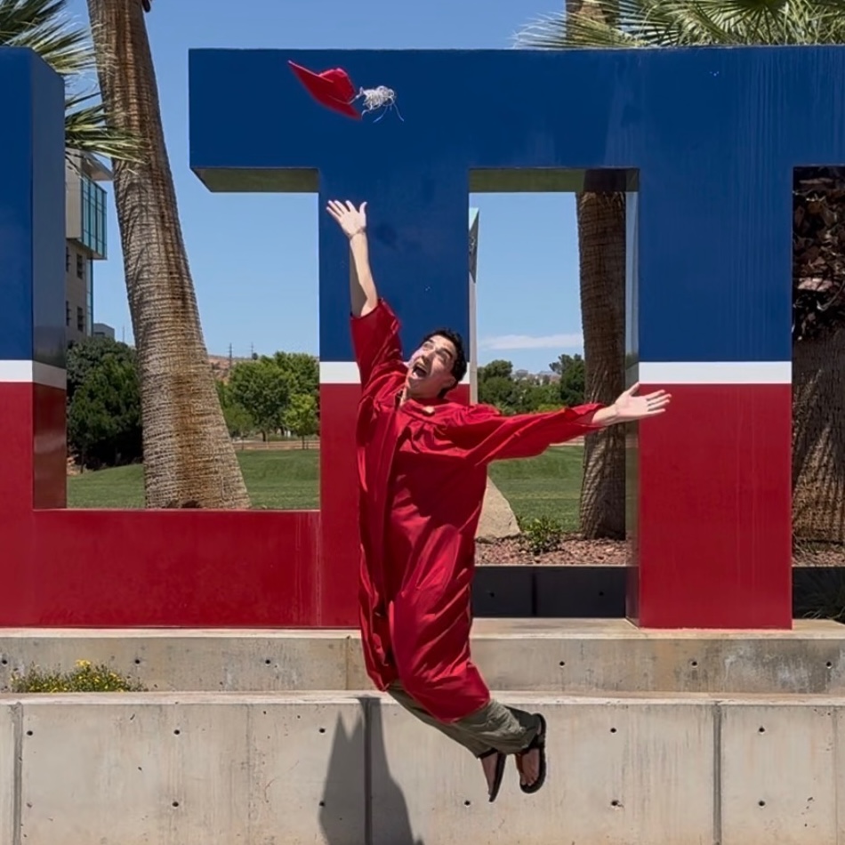 image of me, jumping in the air, throwing my graduation cap.